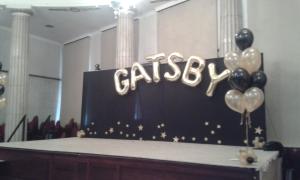Stage Display. Giant Letters with large helium bouquets.